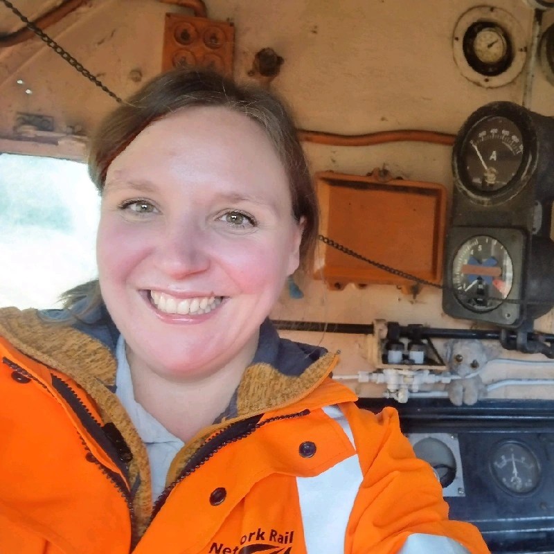 Picture of Fiona Moore smiling at the camera in a high vis jacket